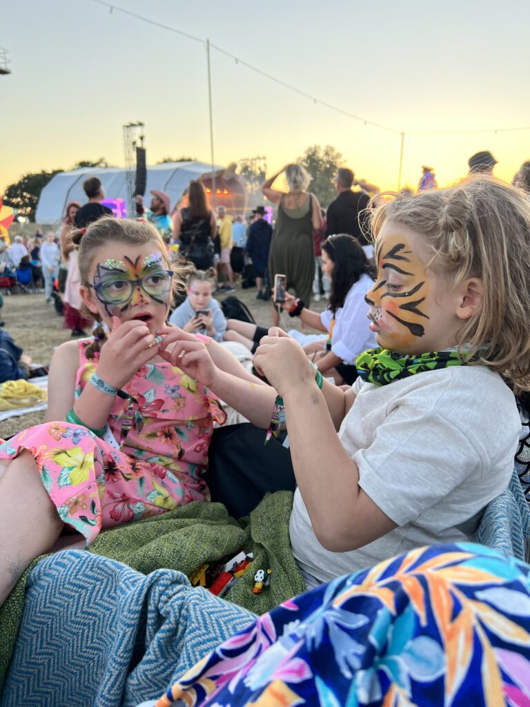 a couple of kids sitting next to each other, Beginner's Guide to Family Festivals