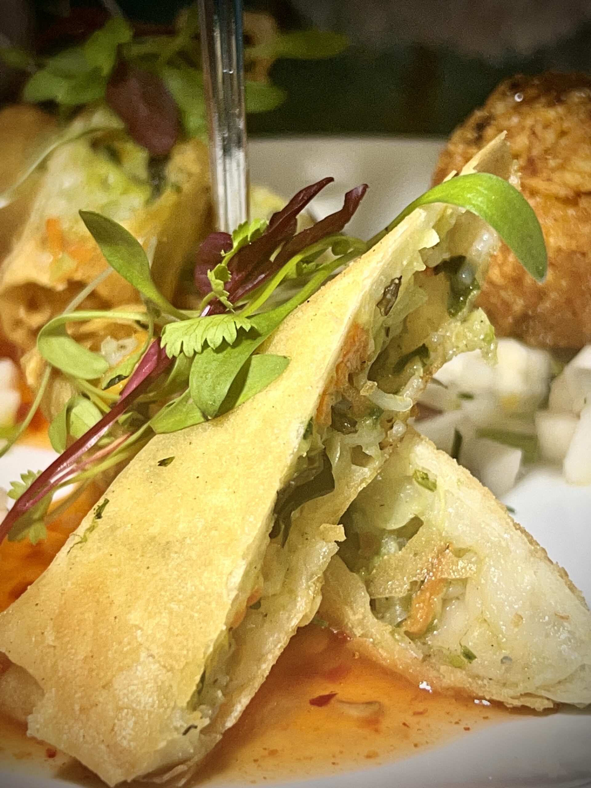 a white plate topped with food and a fork.