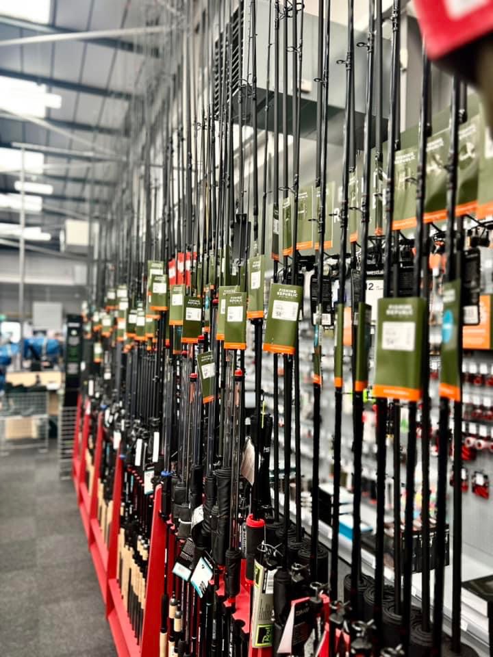 a rack of skis and poles in a store.