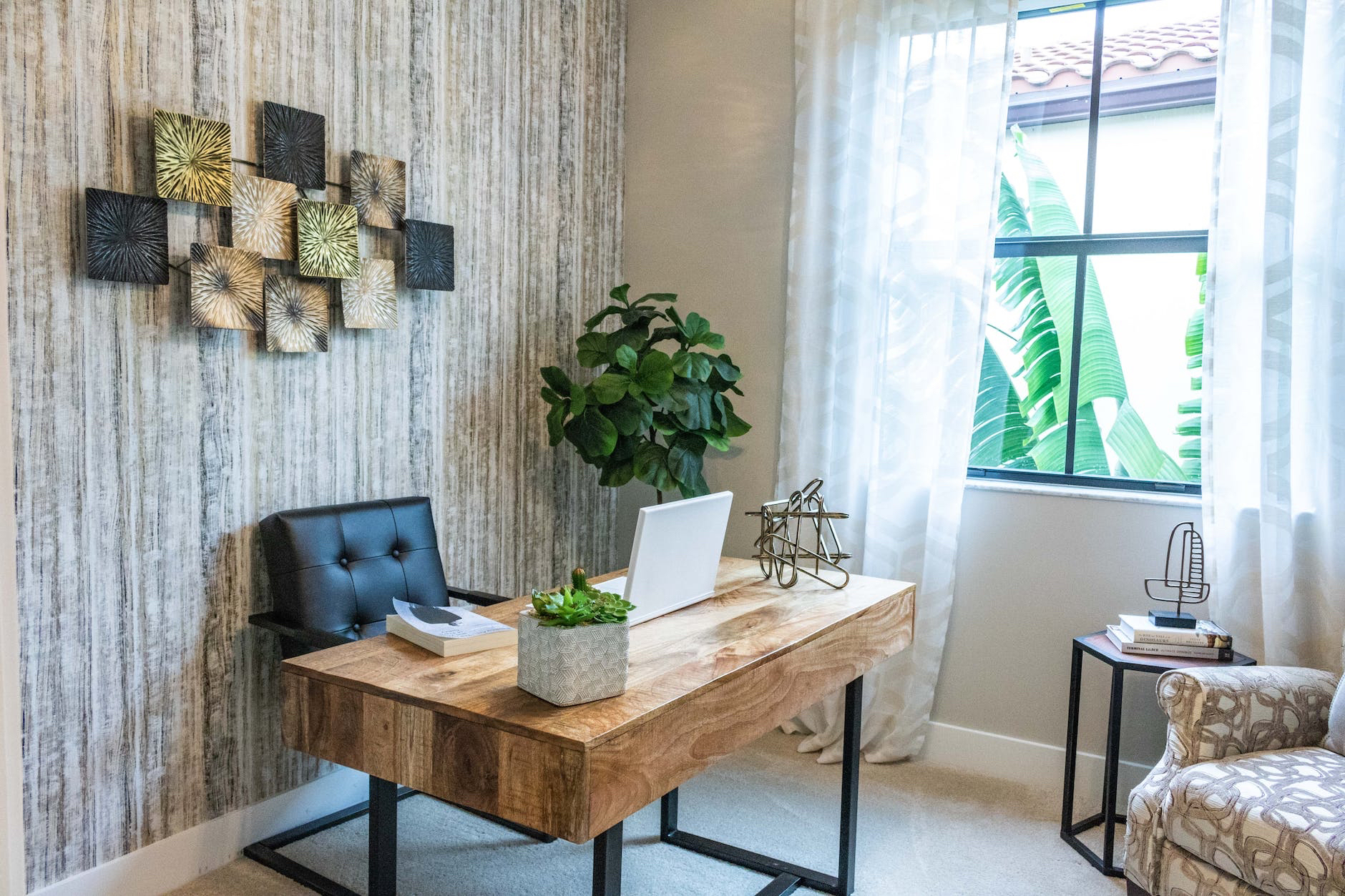 A home office with a desk and chair.