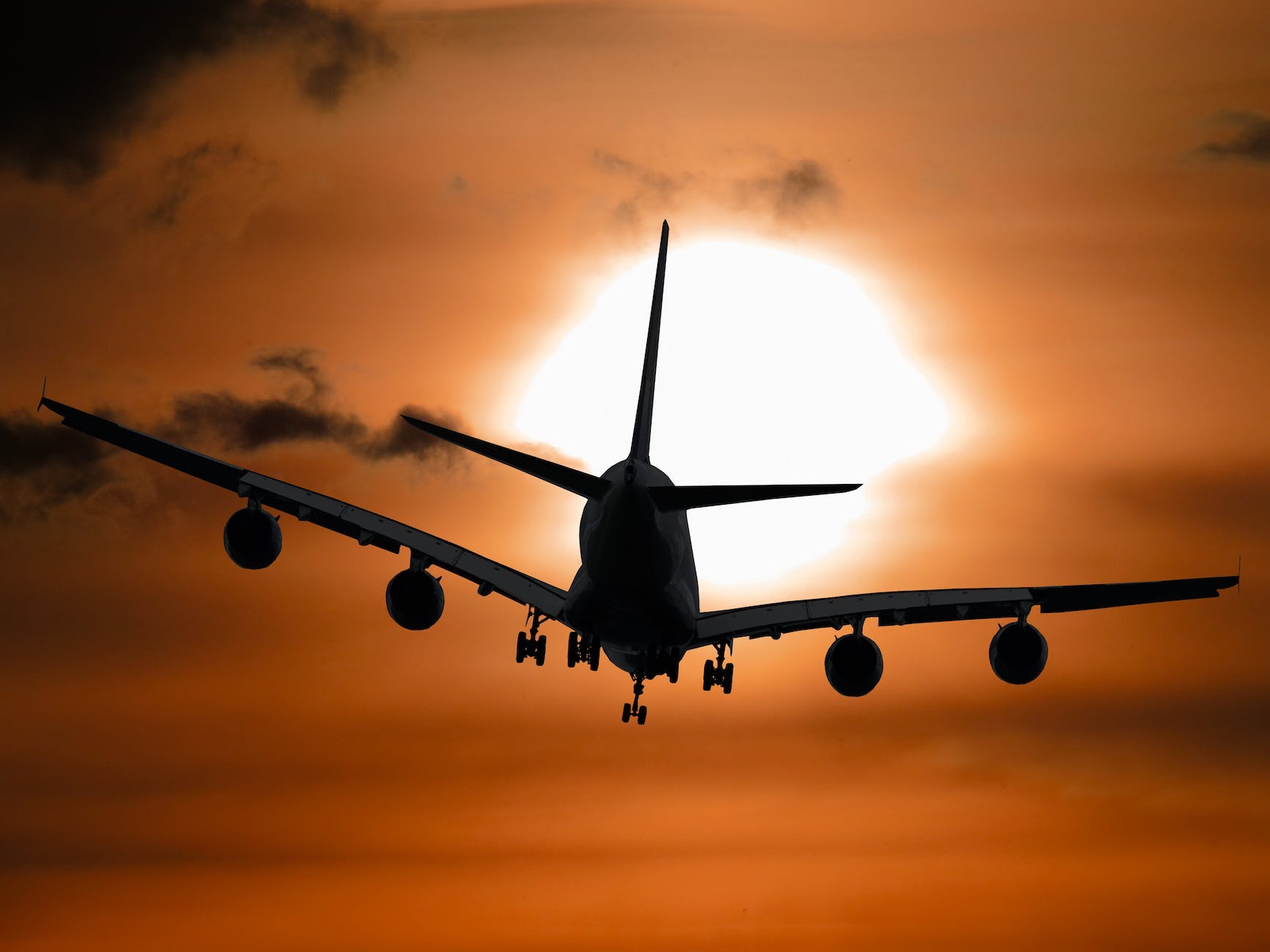 A large airplane flying in the sky.