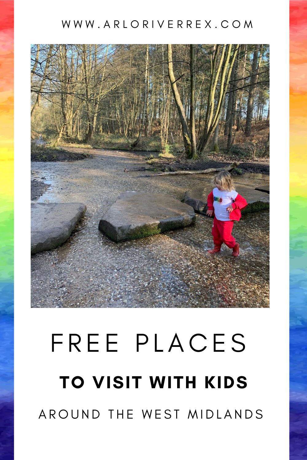A young child in red crosses a shallow stream on stepping stones in a sunlit, wooded area.
