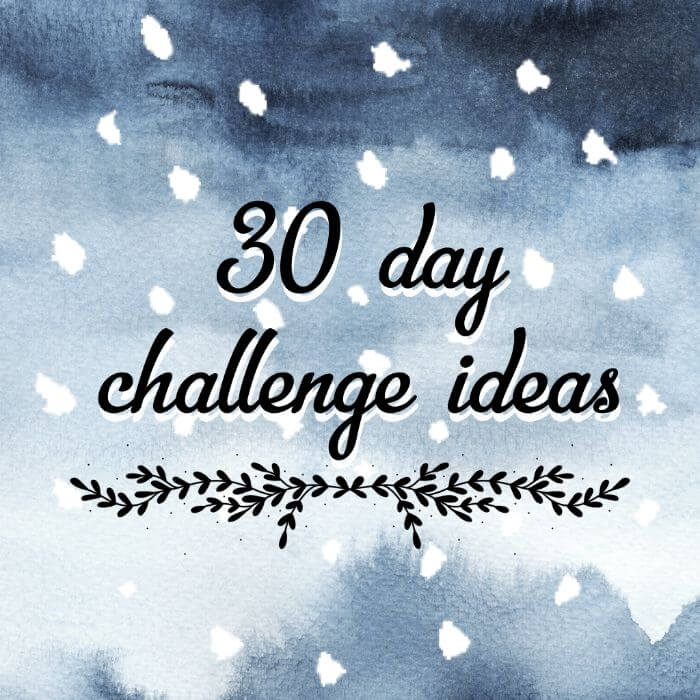 The image shows the words “30 day challenge ideas” in a black script font on a blue watercolour background with white dots and a leafy divider.